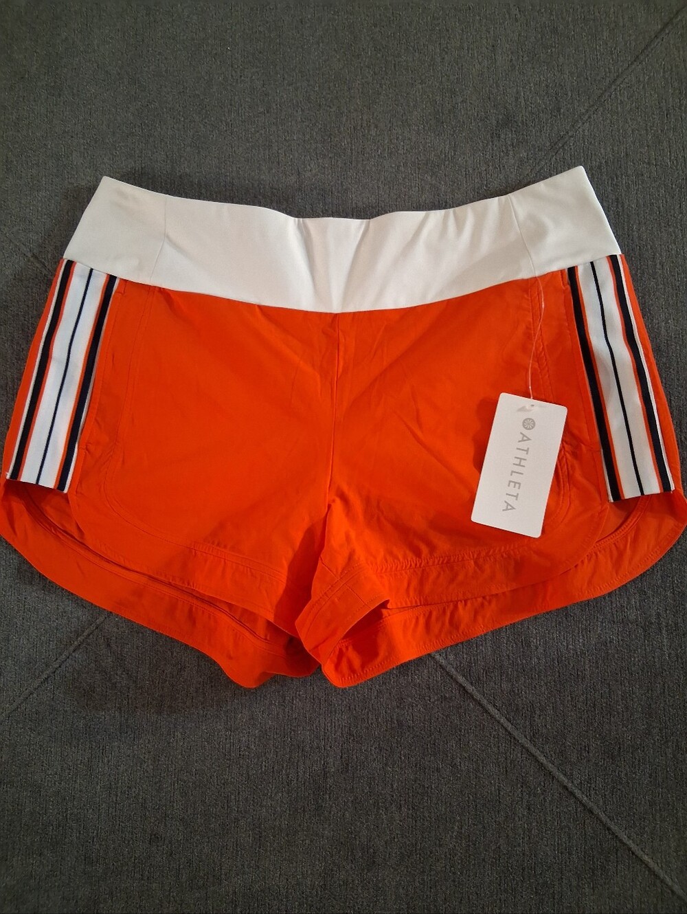 Athleta Orange Athletic Shorts with White Waistband and Striped Sides